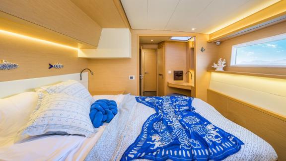 Largo Winch features a stylish double guest cabin, offering a comfortable catamaran charter stay in Mykonos.