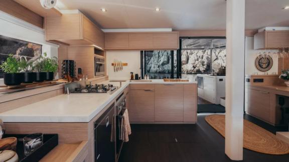 Inside Almosta Road is a bright kitchen with stove, oven and window to cliffs.