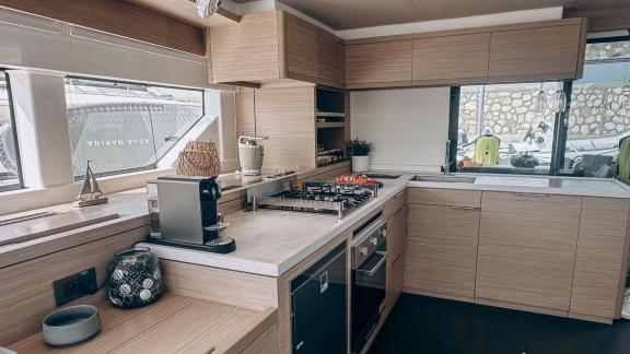 Aurelia’s spacious galley features a stove, oven, and modern storage cabinets.