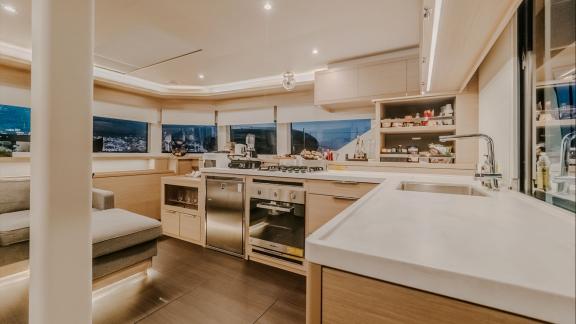 Tri Wing’s Lagoon 55 galley is fully equipped and spacious, perfect for preparing meals while enjoying sea views.