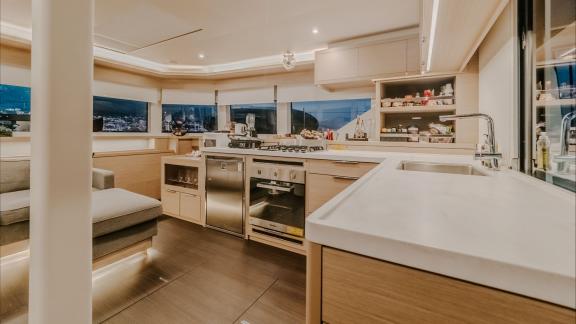 Among catamaran rental options in Kastela Triwing Ossus kitchen and preparation area offers clean and functional onboard