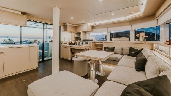 Among catamaran rental options in Kastela Triwing Ossus interior seating and dining area offers a comfortable onboard sp