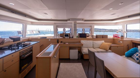 Topaz Lagoon 560 catamaran features a stylish saloon and fully equipped kitchen lit by panoramic windows.