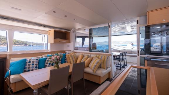 Topaz Lagoon 560 catamaran’s saloon features panoramic windows and a stylish interior for a relaxing cruise.