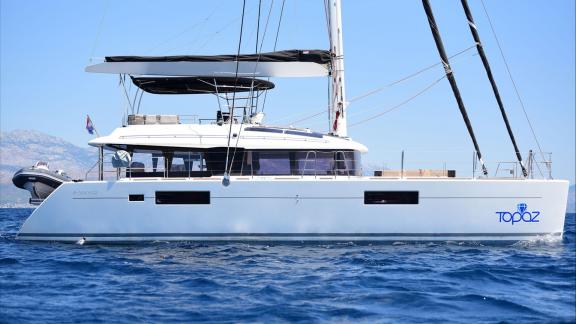 The Lagoon 560 Topaz features sleek lines and a spacious design that stands out on the water.