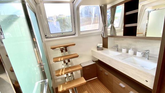 Grace Lagoon 620 catamaran bathroom features twin sinks and natural light.