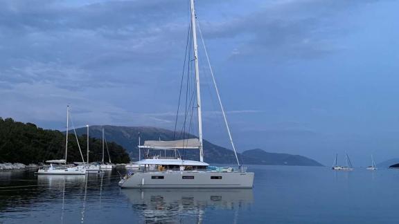 In the evening Grace Lagoon 620 catamaran rests in a quiet bay.