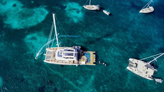 Lagoon Sixty 5 offers water toys and a floating deck for fun and relaxation at sea.