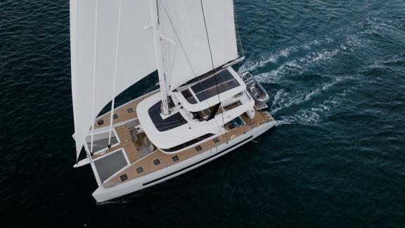 Lagoon Sixty 5 TriWing Endor sails smoothly with full sails on the open waters of Kastela, Croatia.