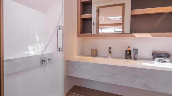 TriWing Endor’s bathroom offers sleek design with a large mirror and contemporary fixtures throughout.