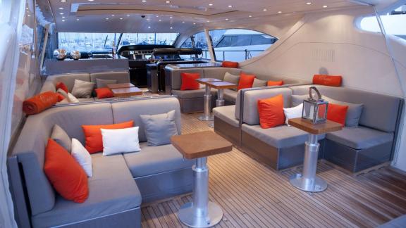 Among Cannes yacht charter options Cristal 1 motor yacht shows aft deck with lounge seating.