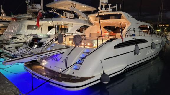 Among Cannes yacht charter options Cristal 1 motor yacht shows illuminated deck and night ambiance.