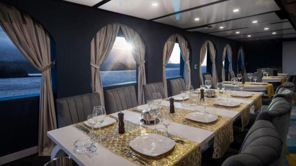 A stylish dining area on the 52-meter motor yacht Limitless, perfect for exclusive dinners in Bodrum.