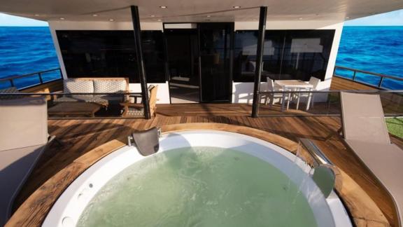 Enjoy pure relaxation in the luxurious hot tub of the 52-meter motor yacht Limitless, available in Bodrum.