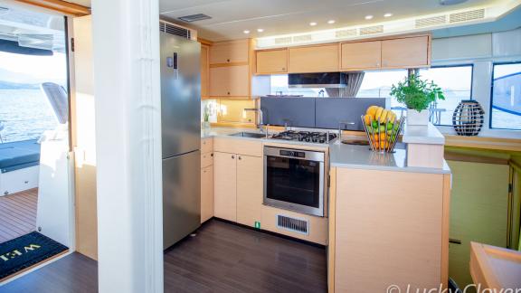 The stylish kitchen on Catamaran Lucky Clover features modern appliances and ample cooking space.