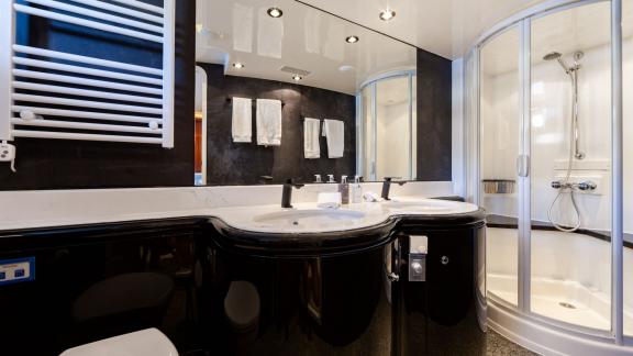 Double sink and spacious shower cabin in Ehthele yacht’s luxurious bathroom.