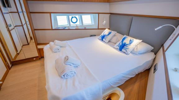 The double cabin on the Gottiri motor yacht features a spacious and modern design.