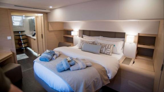 Comfortable and airy master bedroom on the 7th Heaven catamaran in Athens.