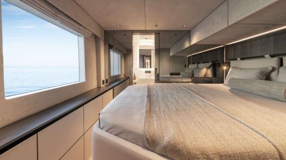 The spacious and modern master cabin of the Adara Next catamaran, departing from Athens, with panoramic sea views.