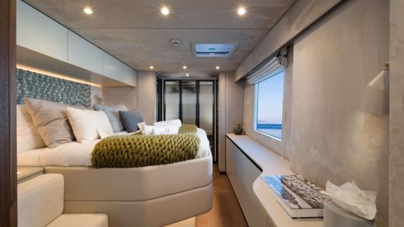 The charter catamaran Ahalya features a spacious, modern master cabin with serene sea views for ultimate relaxation.