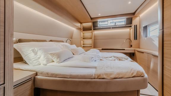 The Lagoon 55’s master cabin offers space, comfort, and natural light for a restful stay onboard.