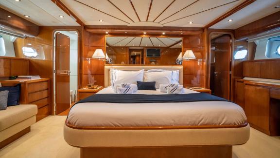 Available for charter in Athens the 4 cabin 10 guest Falcon 86 Estia Poseidon motor yacht offers a bright wood finished