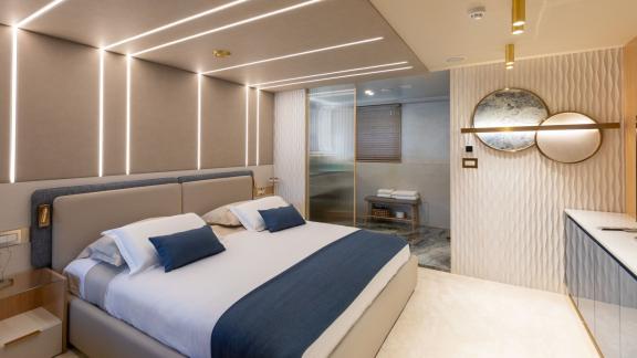 Spacious double bed, LED ceiling lighting and a stylish cabin with glass-enclosed bathroom.