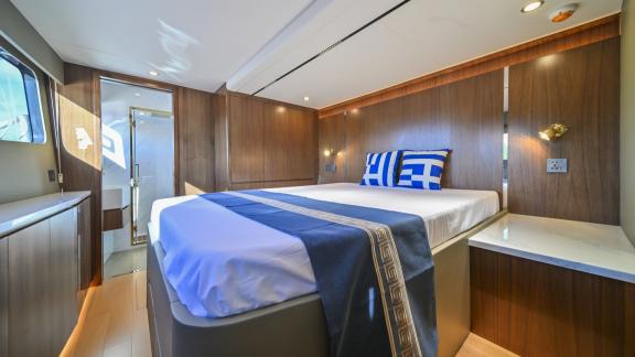 Evita power catamaran features a double bed, wooden interiors and direct access to a private bathroom.
