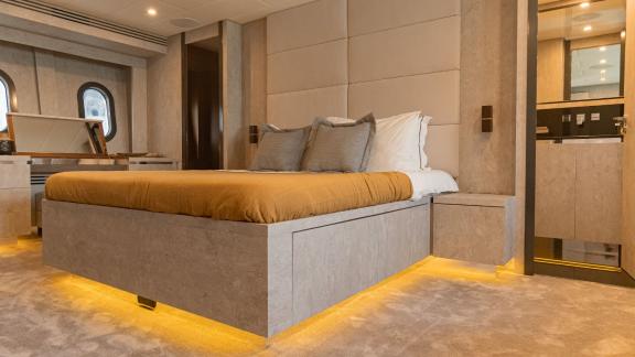 The master cabin of motor yacht La Romana offers luxurious comfort with modern decor and elegant lighting.