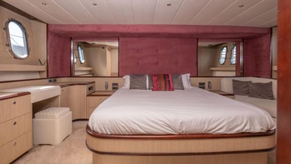 The spacious master cabin of motor yacht Vintage is equipped with luxurious details.