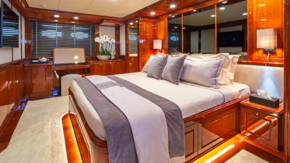 Elegant and comfortable decor in the master bedroom of the Divine yacht.