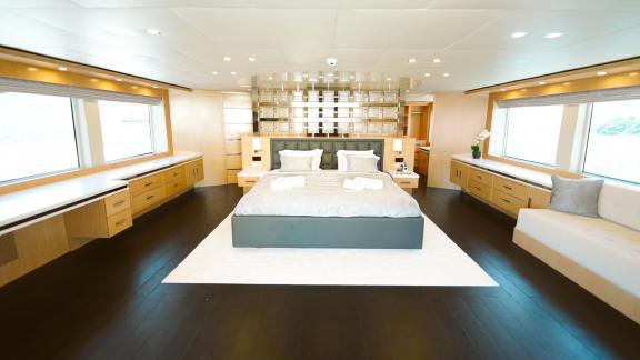 Spacious master cabin of Princess Melda yacht with a bright and comfortable design.