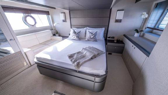 The spacious guest cabin of the Outlaw yacht with elegant decor offers an unforgettable experience in Dubai.