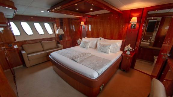 The master bedroom of the Notorious motor yacht provides an elegant and comfortable space for a Dubai yacht rental exper