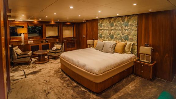 The luxurious master cabin of the Lucien motor yacht offers a comfortable yacht rental experience in Dubai.