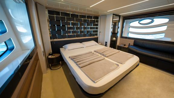 The master cabin of Pershing 70 offers comfort and elegance for your Dubai yacht rental experience.