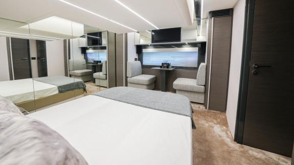 Pershing 5X White features a modern and comfortable bedroom for daily yacht rentals in Dubai.