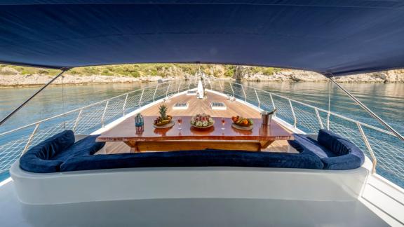 The elegant dining area of the gulet Enjoy Life with a marvellous view of the calm waters of Fethiye.