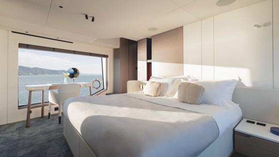 In Sibenik motor yacht charter option First Horizon cabin with double bed and sea view window visible.