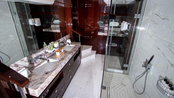 The spacious and luxurious bathroom of the Legende motor yacht adds elegance and comfort to your Dubai yacht rental expe