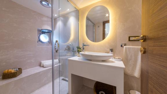 The bathroom on the Floki trawler yacht stands out with its elegant design and stylish decor.