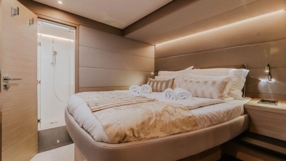 Elegant and cozy, this guest cabin features a private bathroom and soft lighting for added comfort.