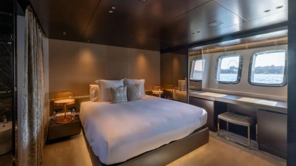 The luxurious master cabin of San Lorenzo Sx88 offers unmatched comfort during a daily yacht rental in Dubai.