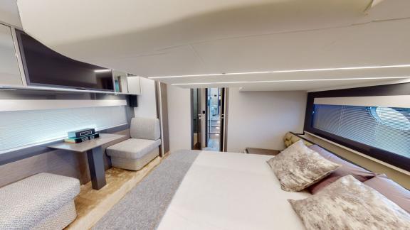 Pershing 5X White stands out with its luxurious and spacious bedroom for motor yacht rentals in Dubai.