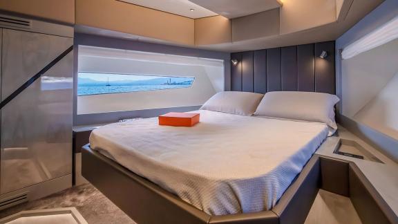 Stylish yacht cabin with large windows and sea view cruising near Mallorca.