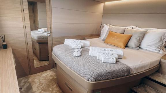 Aurelia’s guest cabin offers a modern design, cozy bed, and thoughtful details for comfort.