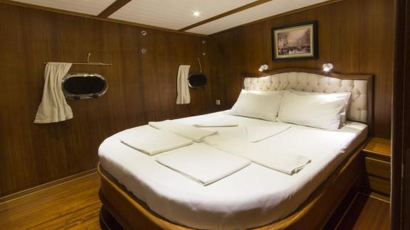 Double cabin on Gulet Cemre 4 featuring a spacious and comfortable bed.