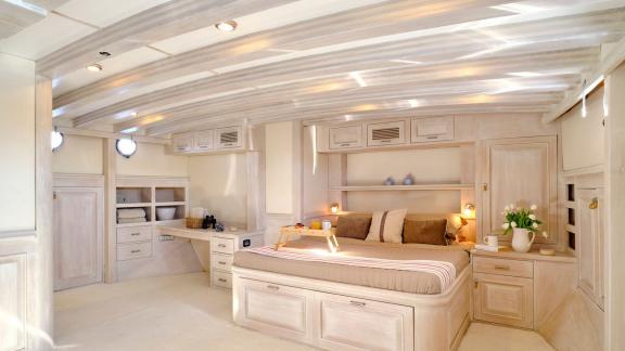 The master cabin of White Pearl gulet in Athens features a double bed and ample storage space.