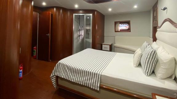 The master cabin of gulet Rose Sah offers a large bed and an en-suite bathroom.