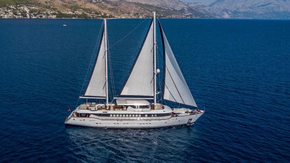 The Omnia sails peacefully over Split's blue waters with coastal views.